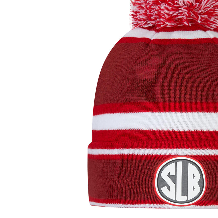 SLB red beanie with a pom pom